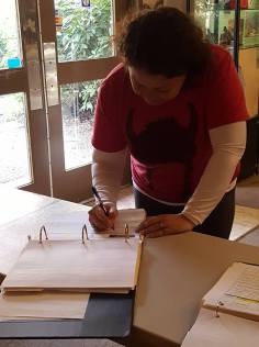 signing the hiker log